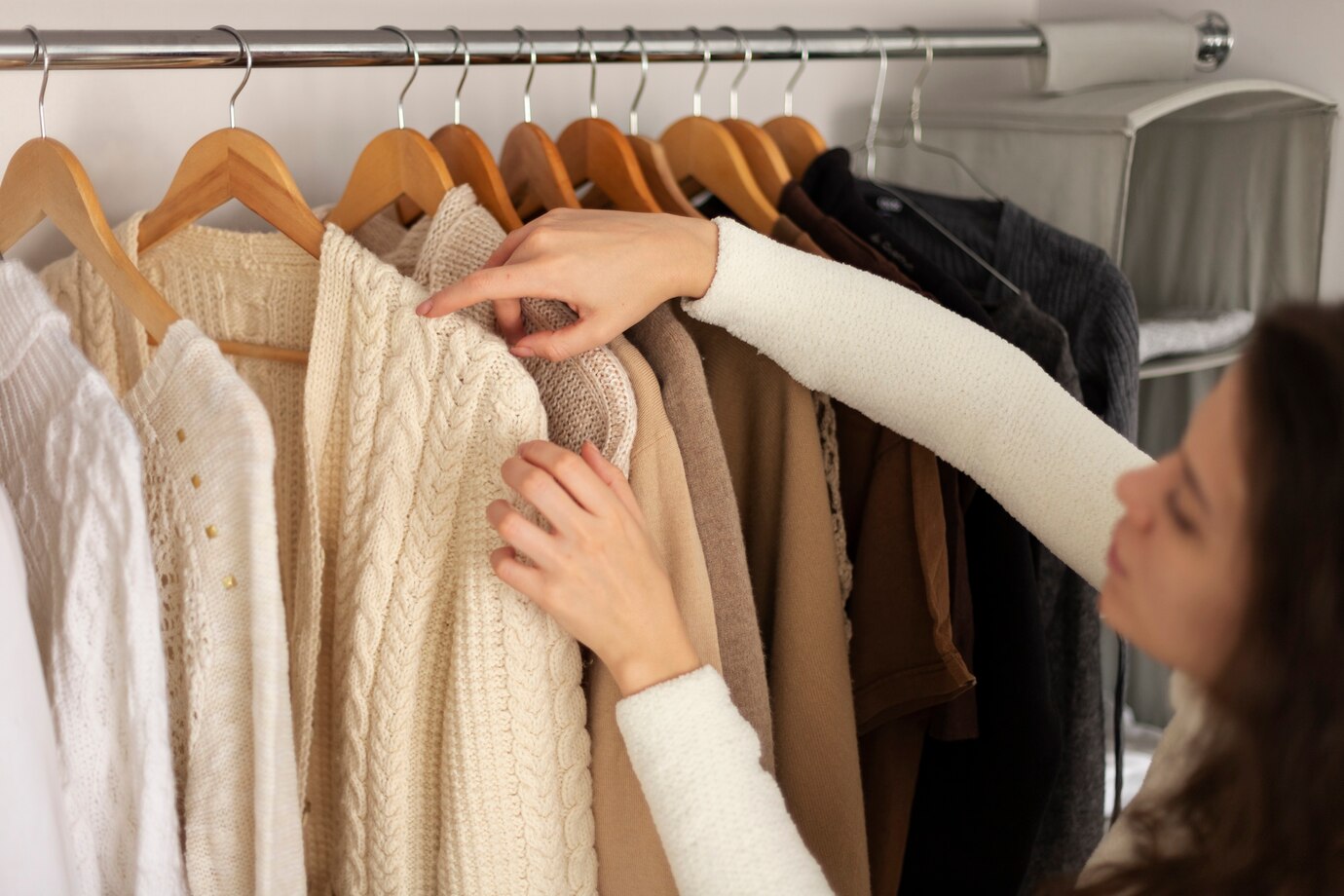 woman arranging wardrobe